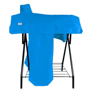 May include: A bright blue saddle cover draped over a black metal saddle stand. The cover features a small rectangular white label on the side. The stand has a black frame with a wire rack base for storage, providing a stable structure for the saddle.