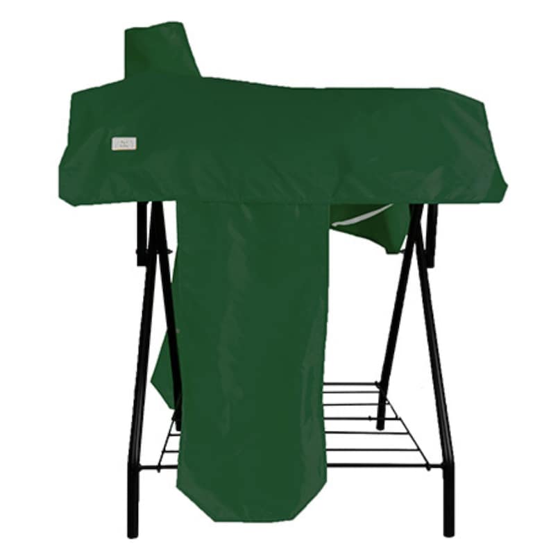 May include: A dark green protective cover draped over a black metal folding stand. The cover features a rectangular white label on the front left side. The stand has a black frame with a slatted base and angled legs supporting the green fabric.
