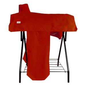 May include: A bright red saddle cover draped over a black metal stand. The cover features a small white rectangular label on the left side. The stand has a wire rack base and four thin black legs that provide a stable structure for the equipment.