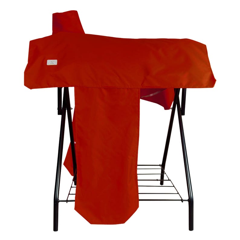 May include: A bright red saddle cover draped over a black metal stand. The cover features a small white rectangular label on the left side. The stand has a wire rack base and four thin black legs that provide a stable structure for the equipment.