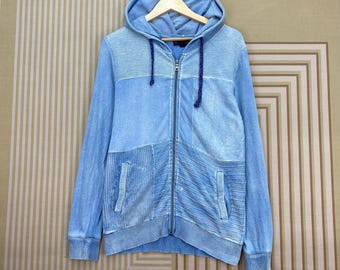 Chaqueta con capucha y cremallera estilo patchwork de la marca japonesa In the attic