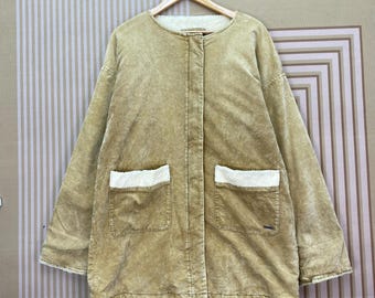 Chaqueta Billabong sin cuello con doble bolsillo y forro de terciopelo tipo sherpa.