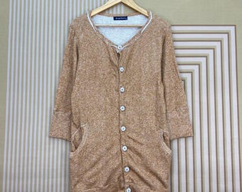 Drug Stores button-down cardigan with three-quarter length sleeves.