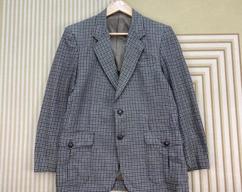 Blazer vintage de lana con estampado de pata de gallo de los años 90 y coderas de ante.