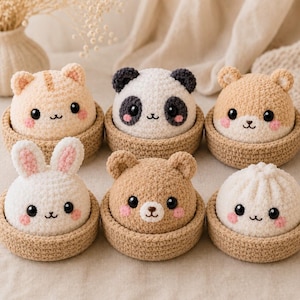 May include: Six small, round, crocheted plush figures, each nestled in a matching tan crocheted bowl. The figures include a cat, panda, hamster, rabbit, bear, and a white bun, all featuring black eyes, embroidered mouths, and pink cheeks.