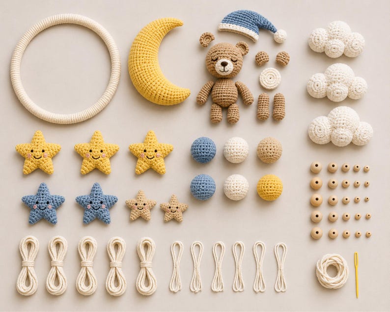 May include: A selection of handmade crochet items, including a teddy bear, crescent moon, stars, clouds, and beads. The colour palette features soft yellows, blues, and creams, ideal for a nursery or baby room. The items are arranged on a neutral background.