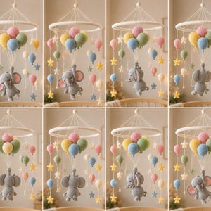 May include: A handmade baby mobile featuring a crochet elephant suspended below a ring with colorful balloons and star accents. The mobile is crafted with soft yarn in pastel colors, creating a whimsical nursery decoration.