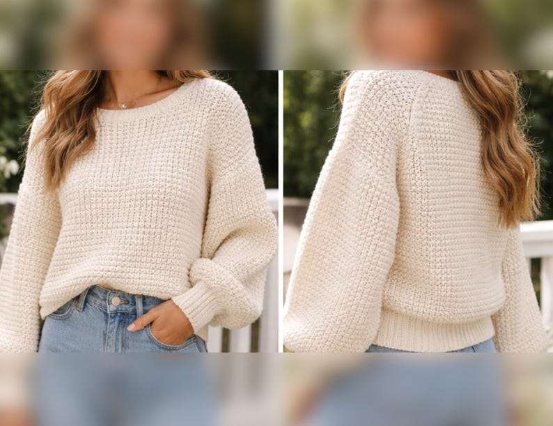 May include: Cream-colored knit sweater with a textured pattern. The sweater has a round neckline and long sleeves with ribbed cuffs. The model is wearing the sweater with blue jeans. The sweater is a cozy and comfortable garment.