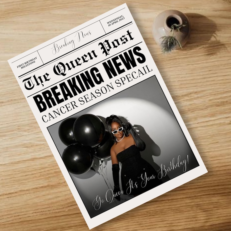 May include: A newspaper-style birthday card with the headline "BREAKING NEWS" and the text "CANCER SEASON SPECAIL." The card features a photo of a person in a black dress holding black balloons. The text "Go Queen It's Your Birthday!" is also visible.