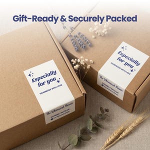 May include: Two brown cardboard boxes with white labels that read "Especially for you" and "Handmade with Love." The boxes are decorated with sprigs of dried flowers and the text "Gift-Ready & Securely Packed."
