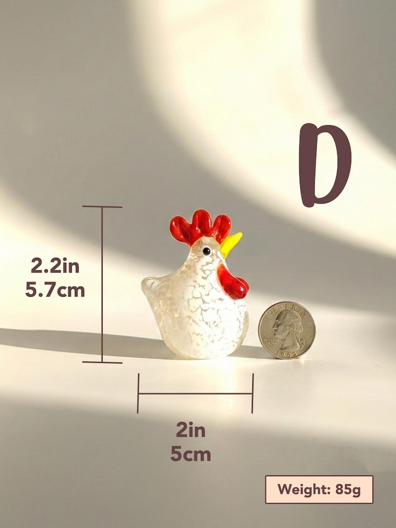 May include: A small, decorative glass rooster figurine. The white body has a speckled pattern, with red comb and wattle, and a yellow beak. The rooster is 2.2 inches (5.7 cm) tall and 2 inches (5 cm) wide. Weight: 85g.