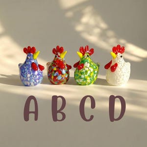 May include: Four colorful glass rooster figurines. Each rooster has a red comb, yellow beak, and red wattle. The bodies are decorated with blue, red, green, and white speckled patterns. The letters A, B, C, and D are below the figurines.