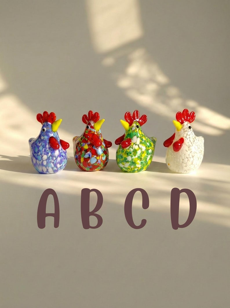 May include: Four colorful glass rooster figurines. Each rooster has a red comb, yellow beak, and red wattle. The bodies are decorated with blue, red, green, and white speckled patterns. The letters A, B, C, and D are below the figurines.