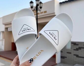 Selling white and black slippers for men and women