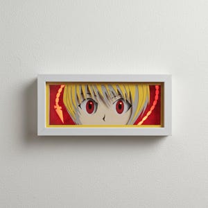 May include: A framed anime art piece featuring a character's eyes. The eyes are large and red, with yellow hair and a red background. The artwork is in a white frame with a yellow border.