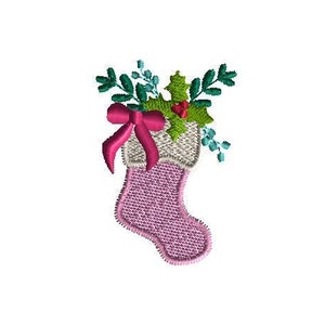 May include: Embroidered Christmas stocking in shades of pink, with a white cuff and a pink bow. The stocking is filled with green holly leaves, red berries, and blue accents. A festive holiday design.