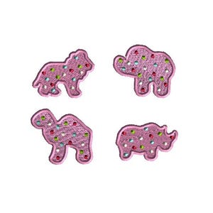 May include: Four pink embroidered animal patches: a lion, an elephant, a camel, and a rhinoceros. Each patch is covered in colorful polka dots. These patches are ideal for adding a playful touch to clothing or accessories.