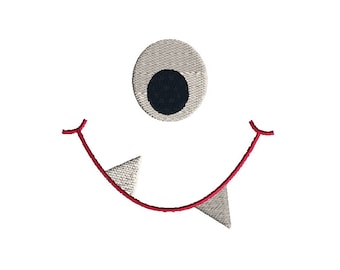 May include: An embroidered design featuring a single large eye with a white iris and a dark navy pupil, positioned above a wide red curved mouth line that includes two sharp, light gray triangular teeth pointing downward from the smile.