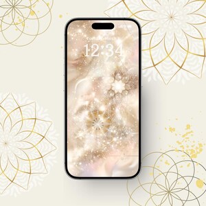 May include: A smartphone displays a digital wallpaper with a gold and white floral design. The screen shows the date and time, with a cream-colored background and gold accents. The phone is surrounded by decorative floral patterns.
