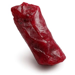 May include: A single, irregularly shaped object with a deep red color. The surface appears textured and slightly translucent, with subtle variations in tone. The object is set against a plain white background.