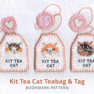 May include: Embroidered cat teabags with pink heart tags. Each white teabag features a different cat face and the text "KIT TEA CAT". The tags have a white heart design. The image also includes the text "Kit Tea Cat Teabag & Tag Bookmark Pattern".