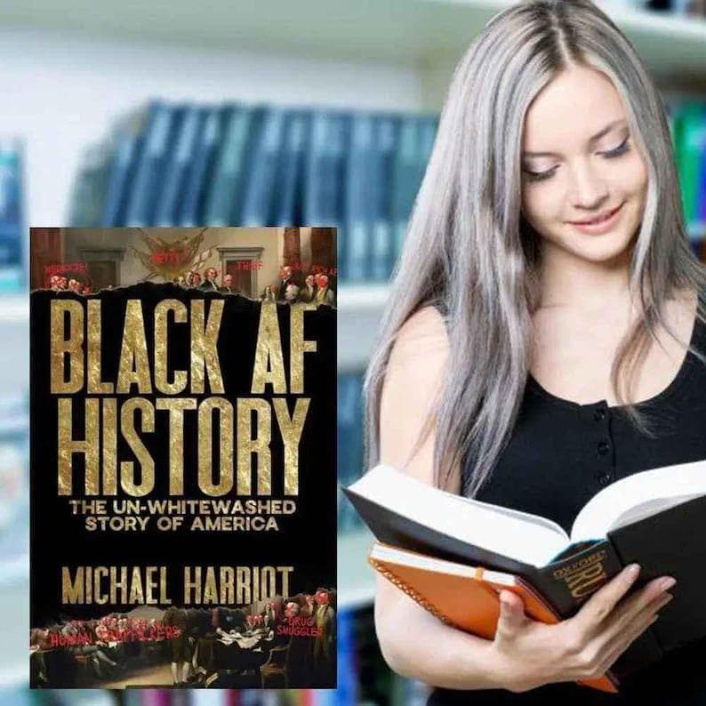 May include: A book cover with the title "BLACK AF HISTORY" in gold lettering. The subtitle reads "THE UN-WHITEWASHED STORY OF AMERICA" with the author's name, Michael Harriot, below. A person is holding the book and another with an orange cover.