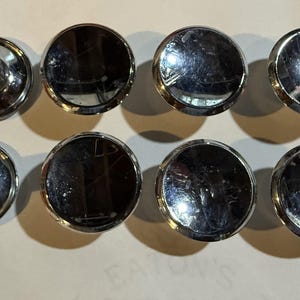 May include: A rustic wooden sign with the text "Welcome to our home" in white lettering. The sign features a distressed finish and a simple, inviting design, perfect for a front porch or entryway.