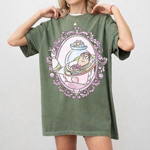 May include: A set of three ceramic mugs with a speckled, matte finish. The mugs are in shades of cream, light gray, and dark gray. Each mug has a simple, minimalist design and a rounded handle. The mugs are likely for coffee or tea.