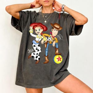 May include: A set of three ceramic mugs with a speckled, matte finish in cream, light grey, and dark grey. Each mug has a simple, minimalist design and a rounded handle.