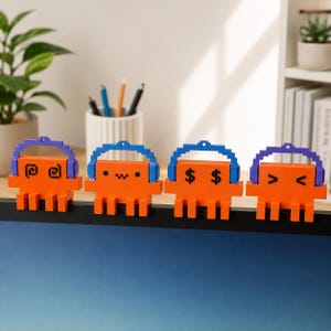 May include: Four orange pixel-art style figures with blocky bodies and multiple legs, each wearing a different colored headset. The figures feature black facial expressions including swirls, a winking face, dollar signs, and a smiling face.