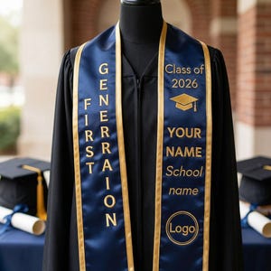 May include: A black graduation gown with a navy blue sash. The sash has gold trim and text that reads "GENERATION FIRST" and "Class of 2026". The sash also has space for a name, school name, and logo.