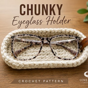 May include: An oval-shaped, cream-colored crochet eyeglass holder with a brown leather tag. The holder contains a pair of tortoiseshell-patterned eyeglasses. Text on the image reads: CHUNKY Eyeglass Holder, BEGINNER FRIENDLY, BULKY YARN, HANDMADE WITH CARE, CROCHET PATTERN, COVE & THREAD.