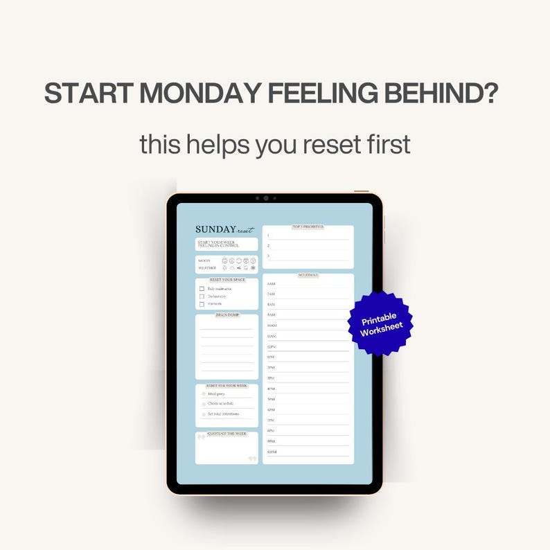May include: A digital tablet displaying a light blue worksheet with the text "SUNDAY reset" and "START MONDAY FEELING BEHIND? this helps you reset first." A blue starburst sticker reads "Printable Worksheet."