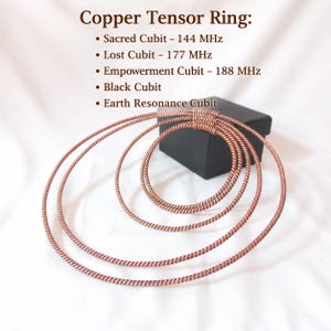 May include: A set of copper tensor rings with a twisted wire texture. The text reads: Copper Tensor Ring: Sacred Cubit - 144 MHz, Lost Cubit - 177 MHz, Empowerment Cubit - 188 MHz, Black Cubit, and Earth Resonance Cubit. The rings are stacked together.
