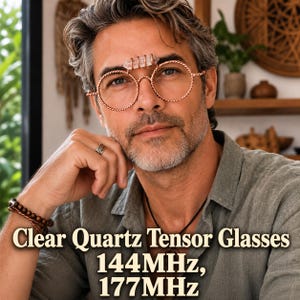 May include: Round glasses featuring a twisted copper wire frame and a clear quartz crystal point mounted on the bridge. The text Clear Quartz Tensor Glasses 144MHz, 177MHz is displayed at the bottom of the image in a bold serif font.