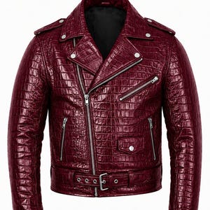 May include: A burgundy leather motorcycle jacket with a textured, crocodile-like pattern. The jacket features a notched collar, multiple zippered pockets, and a belt at the waist. Silver-toned hardware accents the jacket, including zippers and snaps.