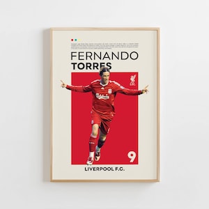 Pode incluir: Um poster emoldurado com Fernando Torres em uniforme vermelho do Liverpool F.C., com os braços estendidos. O poster inclui o texto "FERNANDO TORRES" e "LIVERPOOL F.C." com o número "9". O fundo é uma mistura de vermelho e creme.