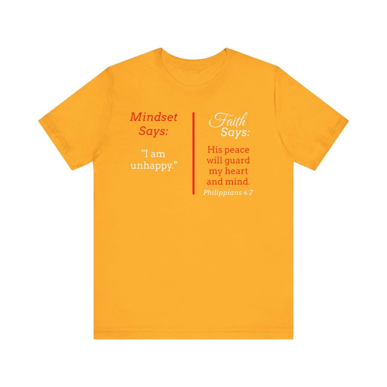 The image is a yellow t-shirt with text and a Bible verse printed on it.