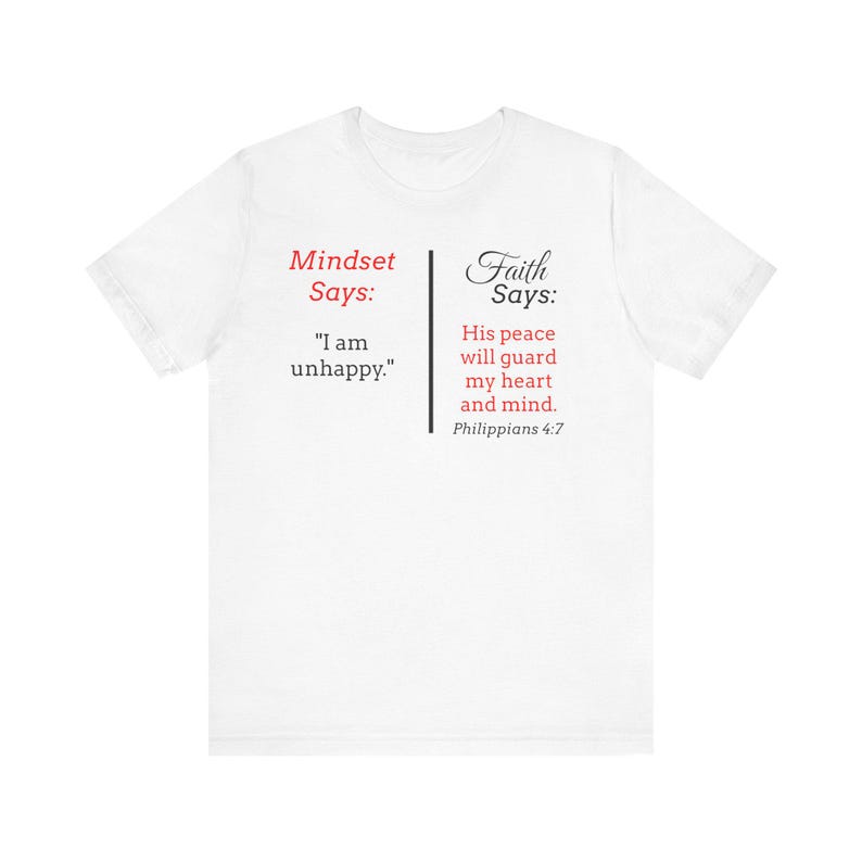 The image is a white t-shirt with text and a Bible verse printed on it.