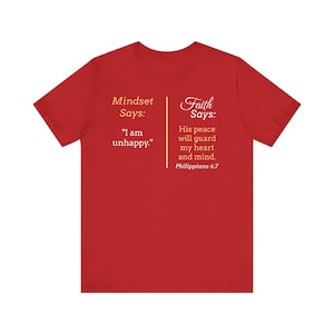 The image is a red t-shirt with text and a Bible verse from Philippians 4:7 printed on it.