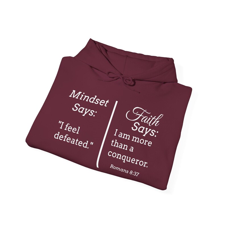 a maroon hoodie with white text and Bible verse references.