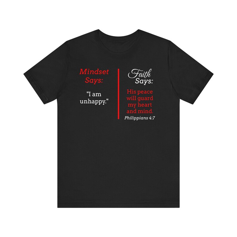 The image is a black t-shirt with text and a Bible verse from Philippians 4:7 printed on it.