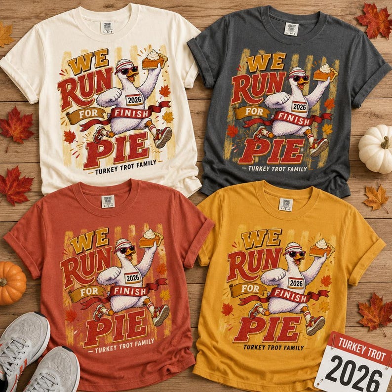 May include: Four short-sleeve t-shirts in cream, charcoal, rust, and mustard yellow. Each features a graphic of a turkey wearing sunglasses and a headband, holding a slice of pie, with the text WE RUN FOR FINISH PIE TURKEY TROT FAMILY 2026.