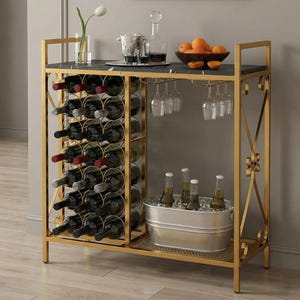 May include: A gold-colored bar cart with a black marble top, holding wine bottles, glasses, and a metal ice bucket with bottles. The cart has a wine rack, glass holders, and a shelf for drinks and snacks.
