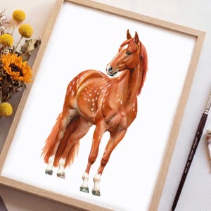 May include: Watercolor painting of a chestnut horse with white markings, set in a wooden frame. The horse is depicted in a dynamic pose, with its head turned and body angled. The artwork features detailed brushstrokes and a natural color palette.