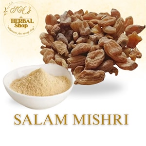 May include: A white bowl filled with light brown powder sits in front of a pile of dried, tan-colored pieces. The image also features the text "SALAM MISHRI" in gold lettering. The top left corner has a logo for "Herbal Shop".