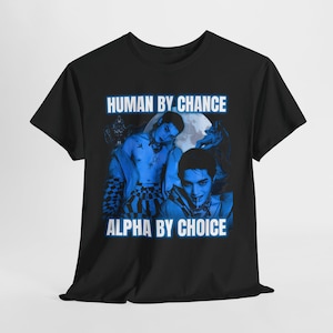 May include: Black t-shirt with a blue graphic featuring two people and the text "HUMAN BY CHANCE" and "ALPHA BY CHOICE". The graphic has a moon and wolf-like figures in the background.
