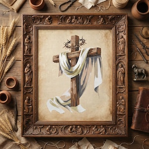May include: A framed cross-stitch artwork depicting a wooden cross draped with a white and beige cloth, and a crown of thorns. The ornate, brown wooden frame features carved religious figures. The artwork is displayed on a wooden surface.