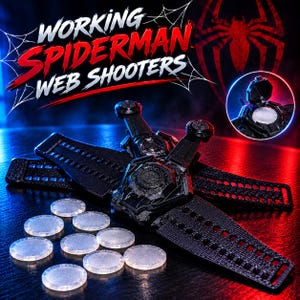 May include: Black wrist-mounted web shooter toy with a textured strap and a central circular mechanism. Includes several small, translucent, circular discs. The text "WORKING SPIDERMAN WEB SHOOTERS" is displayed in white and red lettering above.