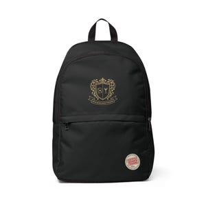 May include: A black backpack featuring a gold-colored crest logo with a playing card and martini glass icon, the text "UPPER MANAGEMENT PARTNERS" below it, and a circular patch at the bottom right with the text "CERTIFIED INSIDER TRADING".